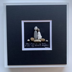 Daughter with her fvather on driftwood